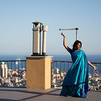 Nadeshwari dancing on the roof of the b&b, Genoa in the background